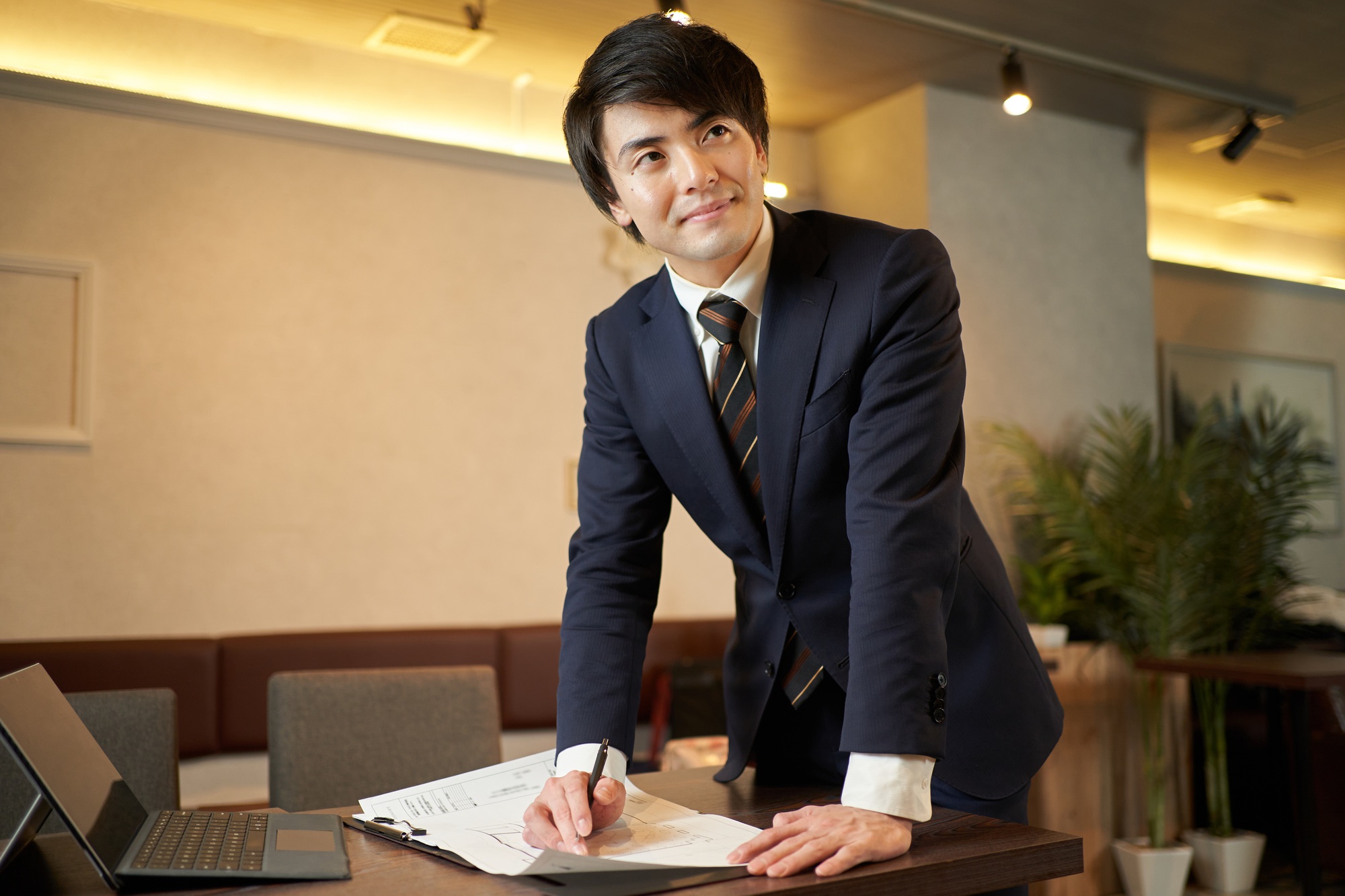 A sales man thinking about a restaurant refurbishment plan