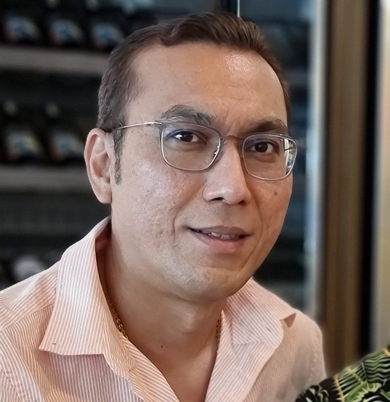 Malaysian couple enjoying a drink at the restaurant